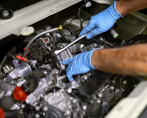 hands-of-a-mechanic-working-on-a-car-engine-P5KZ47G.jpg